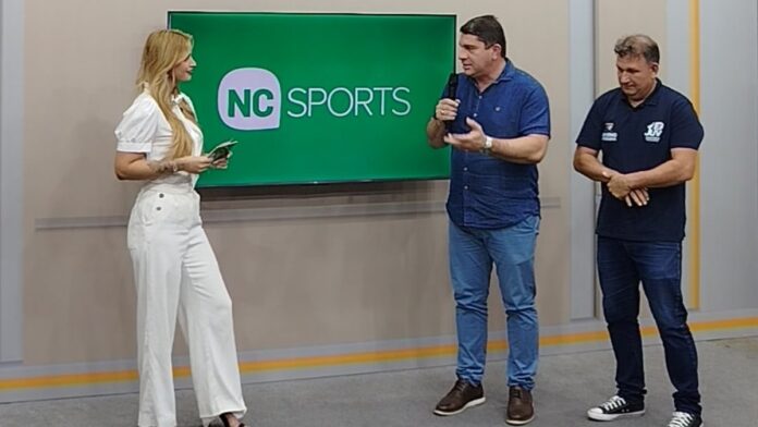 Vista aérea de um moderno complexo esportivo com quadras, pista de atletismo e arquibancadas em Roraima.