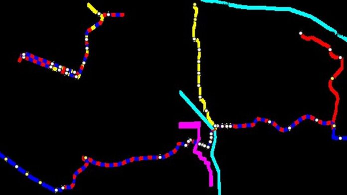 Três smartphones modernos de diferentes marcas lado a lado sobre uma mesa de madeira, focados na tela.