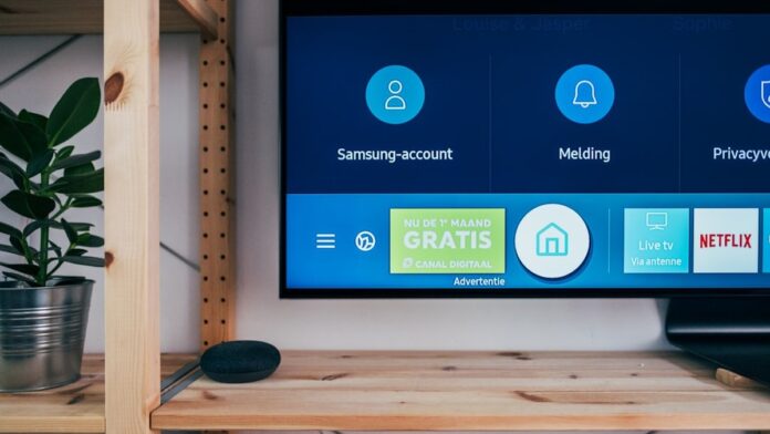 Television on book shelf in living room, next to a Google Home speaker. Picture taken by Jonas Leupe (www.brandstof.cc/jonas)