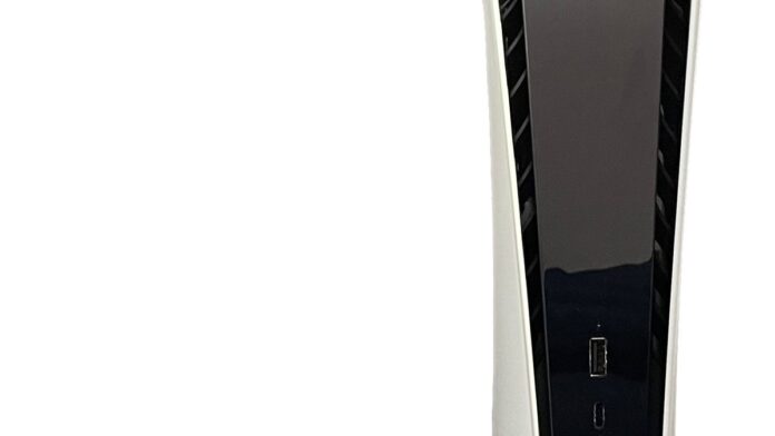 PlayStation 5 Digital Edition standing vertically on its stand with its DualSense controller.