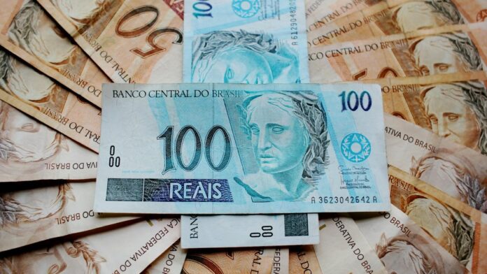 Close-up of Brazilian Real banknotes featuring different denominations and intricate designs.