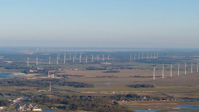 Panoramic aerial view of wind turbines in Osório, Brazil, showcasing renewable energy landscape.