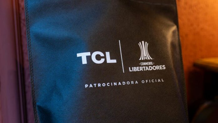 Close-up of a black sponsorship bag showing TCL and CONMEBOL Libertadores logos with brand details.