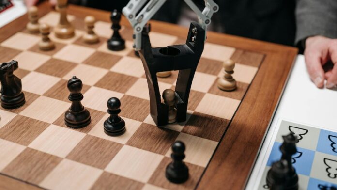 Robotic arm playing a strategic chess game on a wooden board, showcasing technology and innovation.