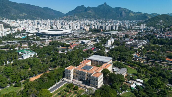 s4-1da9f7919d6a-10 Stunning aerial view of Rio's Maracanã Stadium and cityscape in clear daylight.