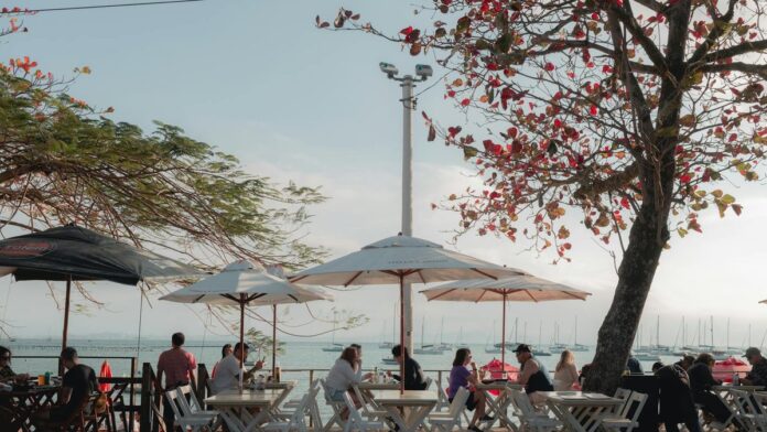 Cozy outdoor cafe by the sea in Santo Antônio de Lisboa, Brazil, capturing a serene summer vibe.