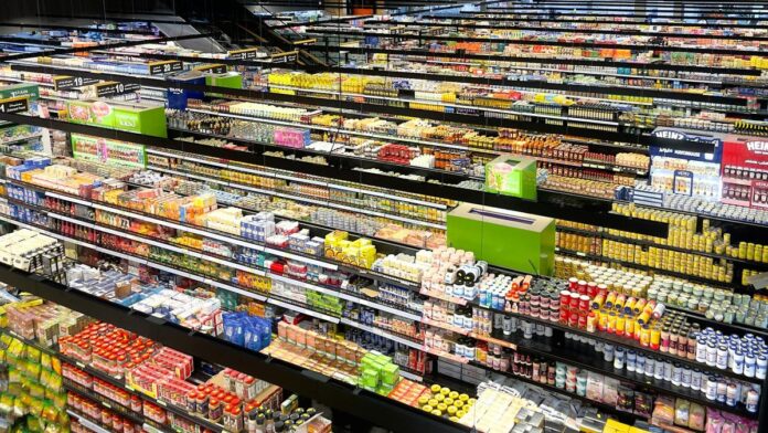 Aerial view of supermarket aisles filled with colorful products and packaging.
