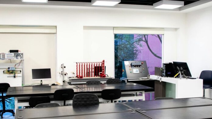 Contemporary lab interior with desks and equipment, perfect for educational purposes.