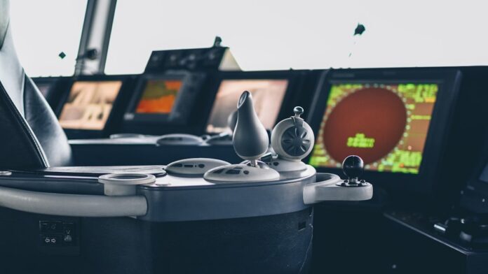 Control panel, joystick, screen and buttons of a cruise ferry in the cockpit.