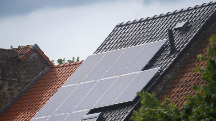 Solar panels installed on a residential rooftop, showcasing eco-friendly renewable energy solutions.