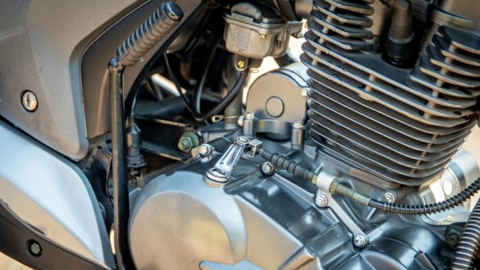 Detailed view of a motorcycle engine showing components and metal textures.