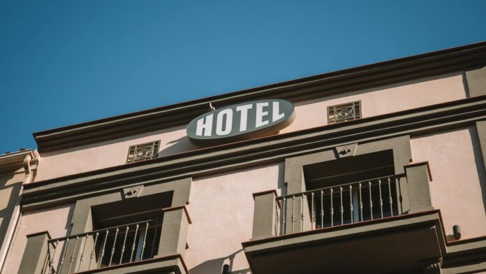 s4-656128081cf4 Elegant low-angle shot of a hotel facade under a clear blue sky, located in Málaga, Spain.