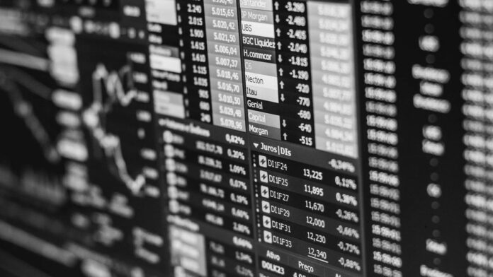s4-84dfd16e24c7 Monochrome image of stock market data on a screen, depicting financial information and trends.