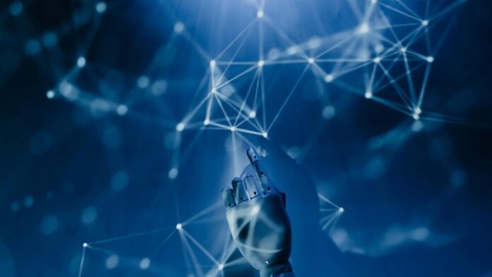 A robotic hand reaching into a digital network on a blue background, symbolizing AI technology.