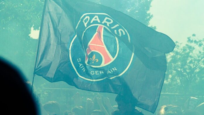 s4-a1c9acc4cf80 A paris saint-germain flag waves in the crowd.