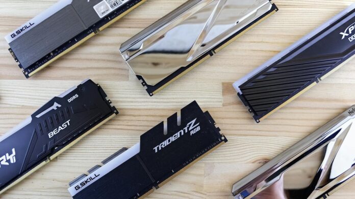 Top view of modern computer RAM sticks arranged on a wooden surface for technology enthusiasts.