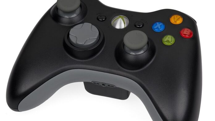 s4-abf9581bd6fb-1 A black wireless Xbox 360 controller.