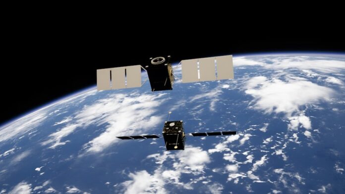 Two satellites docking in space powered by Obruta's RPOD Kit.