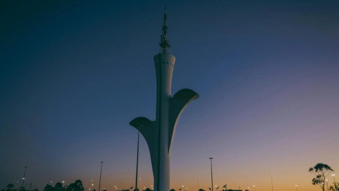 s4-bdd131ce7dd5-17 Stunning view of the Brasilia Digital TV Tower during a dramatic sunset in Brasília, Brazil.