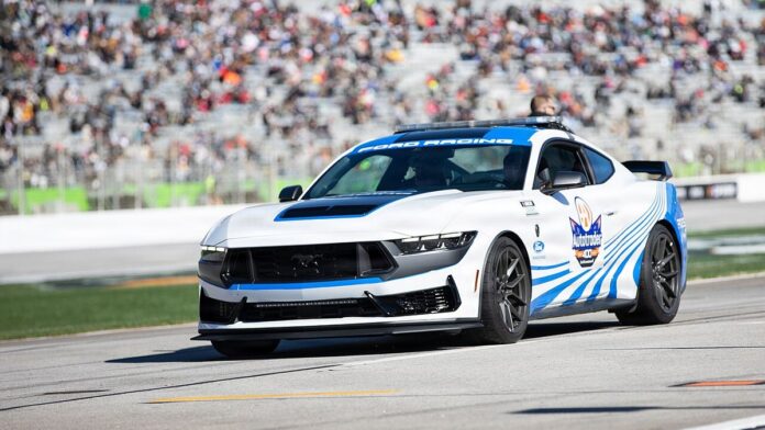 U.S. Army Brig. Gen. Kris Marshall, Director of the Joint Staff, Georgia National Guard, drives the pace car before the start