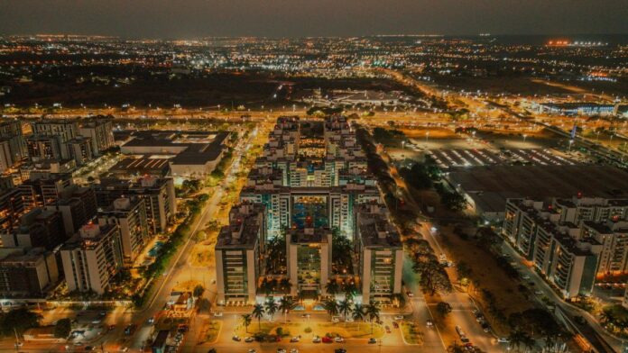 Captivating aerial night shot of Brasília's illuminated urban landscape and busy streets.