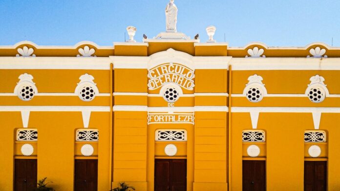 Beautiful yellow facade of Círculo Operário, a historic building in Fortaleza, Brazil.