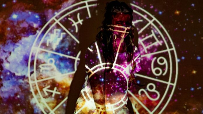 s4-de627cc09983 A mystical image of a woman enveloped in celestial projections and astrological symbols.
