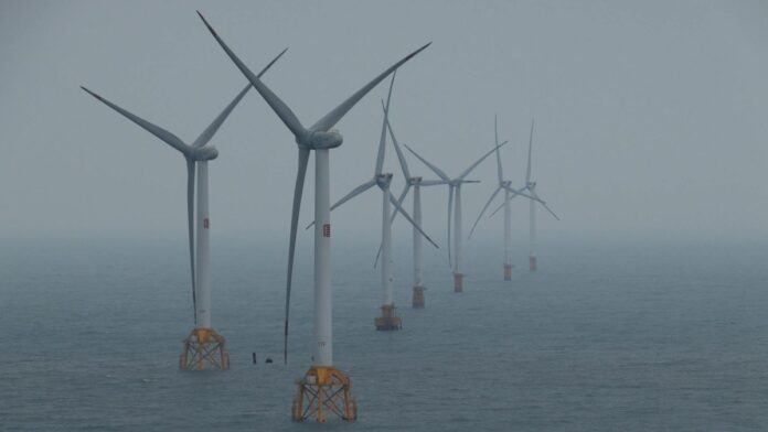 s4-ed1179f11429-2 Offshore wind turbines generating clean energy in the ocean breeze.