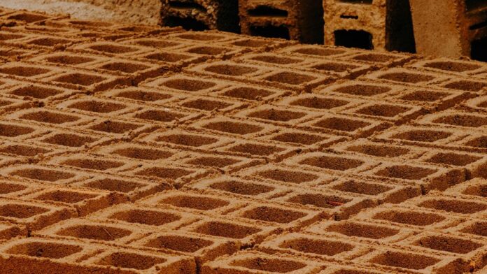 Close-up view of patterned concrete blocks in a construction site.