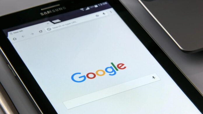 Close-up of a tablet displaying Google's search screen, emphasizing technology and internet browsing.